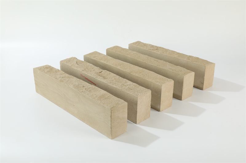 Additional view of beige sandstone walling — natural face