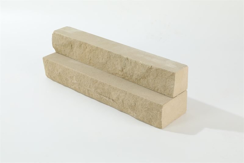 A loose quantity of beige sandstone walling — natural face