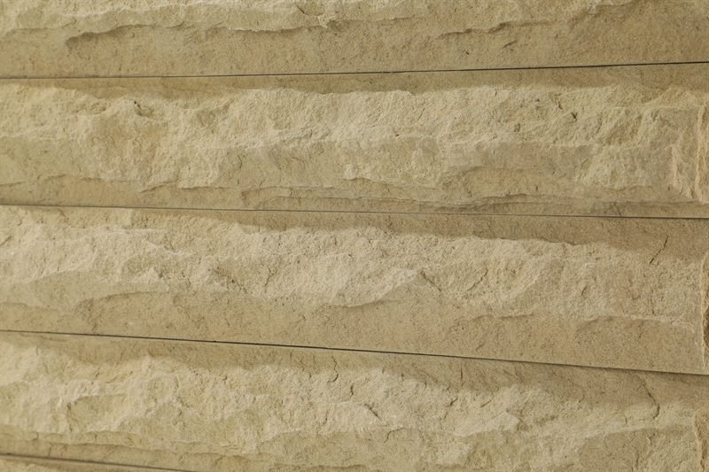 Additional view of beige sandstone walling — mushroom face