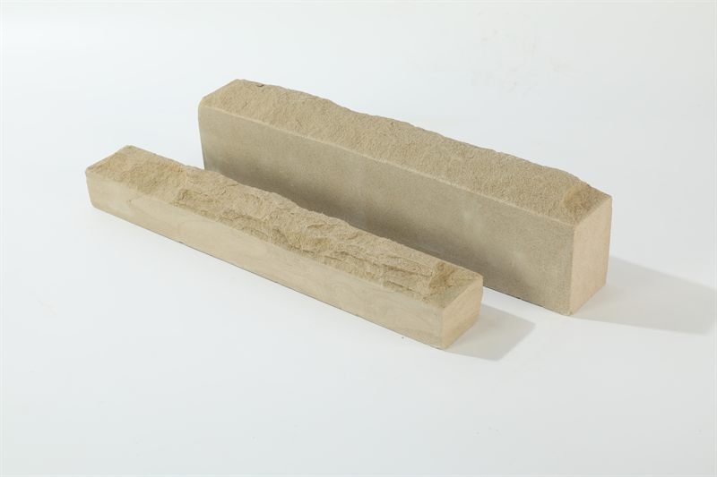 Beige sandstone walling — mushroom face showing surface texture