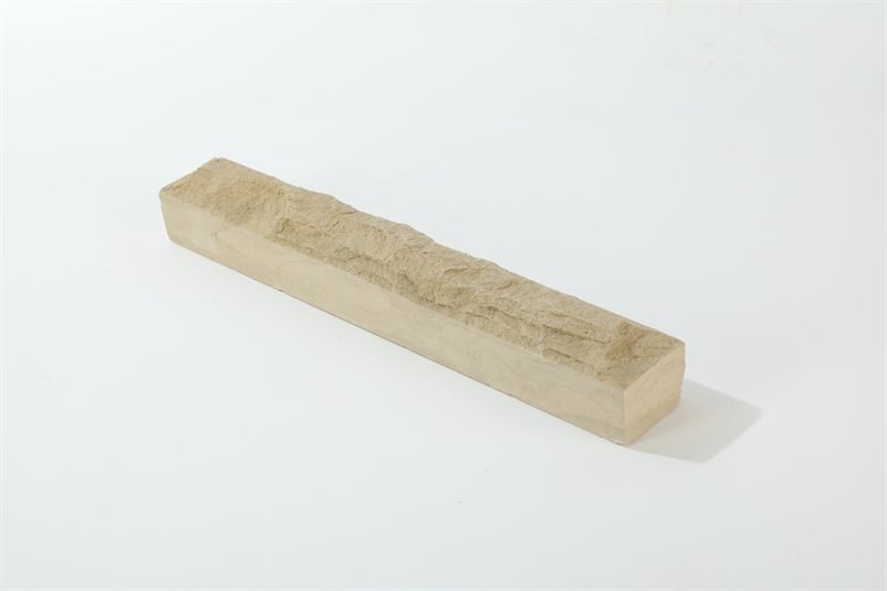 A loose quantity of beige sandstone walling — mushroom face