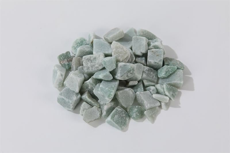 Sea green jade chips in 10–25mm showing natural shape variation
