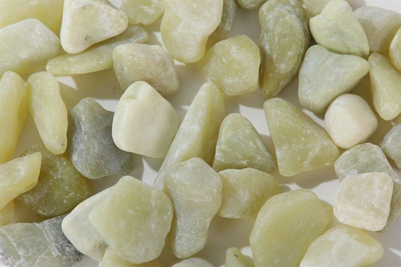 Olive jade pebbles in 15–35mm showing natural shape variation