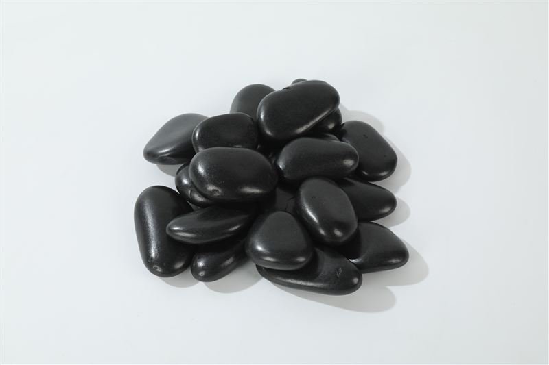 Black high polished pebbles in 30–50mm showing natural shape variation