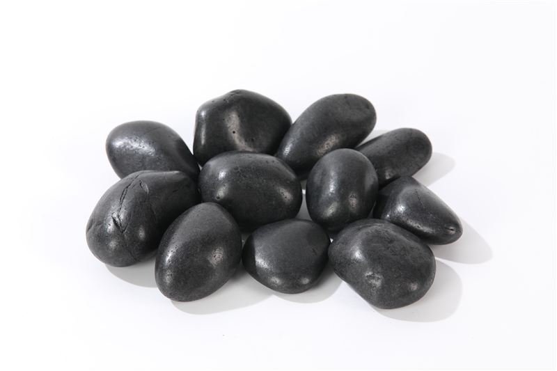 Black polished pebbles showing natural colour and shape variation