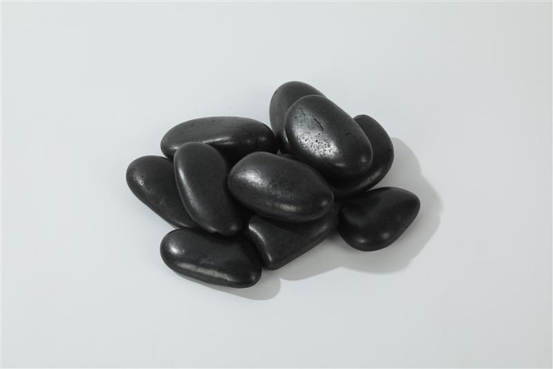 Black polished pebbles in 30–50mm showing natural shape variation