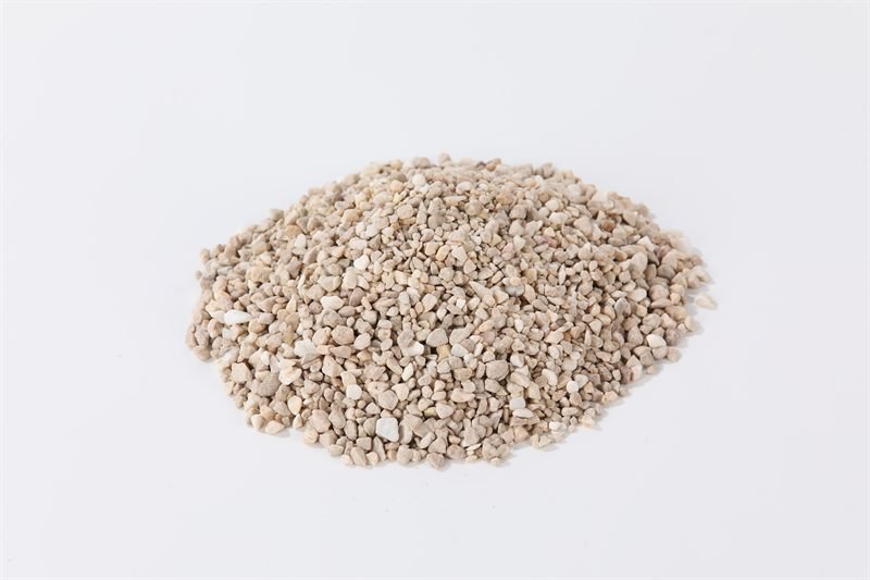 Beige crushed aggregate in 2–5mm showing surface texture