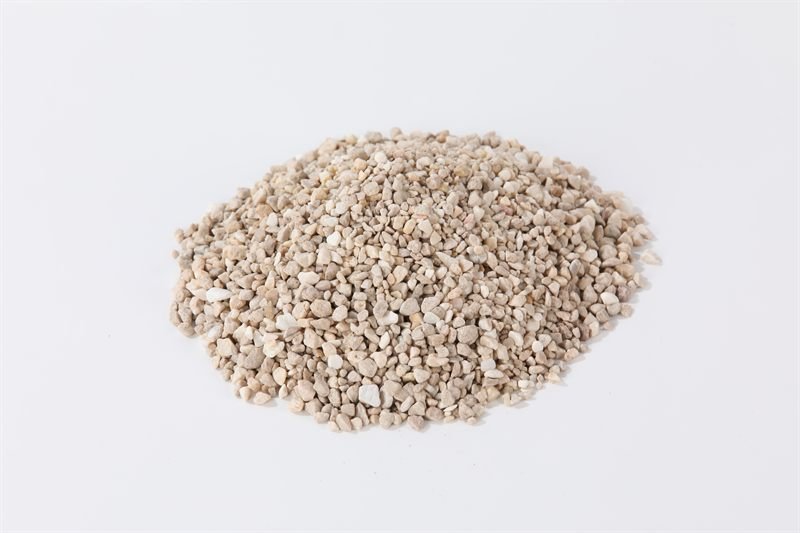 A loose quantity of beige crushed aggregate in 2–5mm