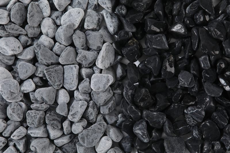 Dark grey rounded gravel in 6–12mm showing natural shape variation