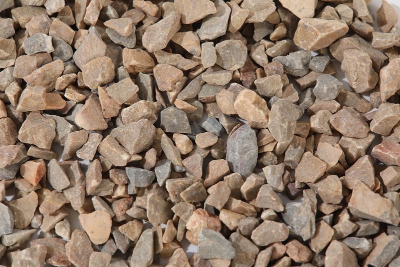 Close-up of floor yellow crushed aggregate in 10–15mm