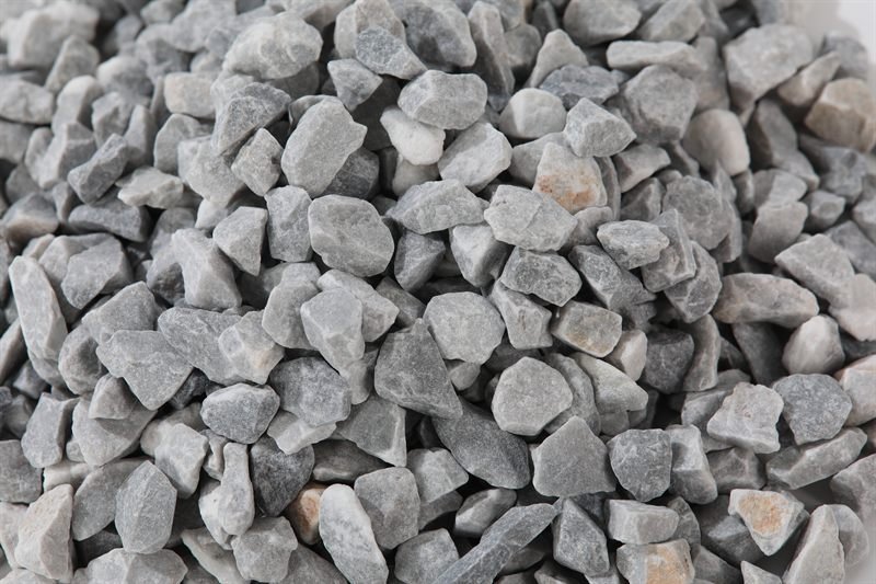 Close-up of light grey crushed aggregate in 10–15mm
