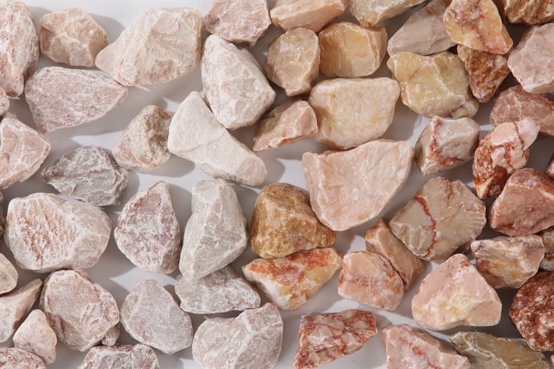 Light pink crushed aggregate in 20–40mm showing natural shape variation