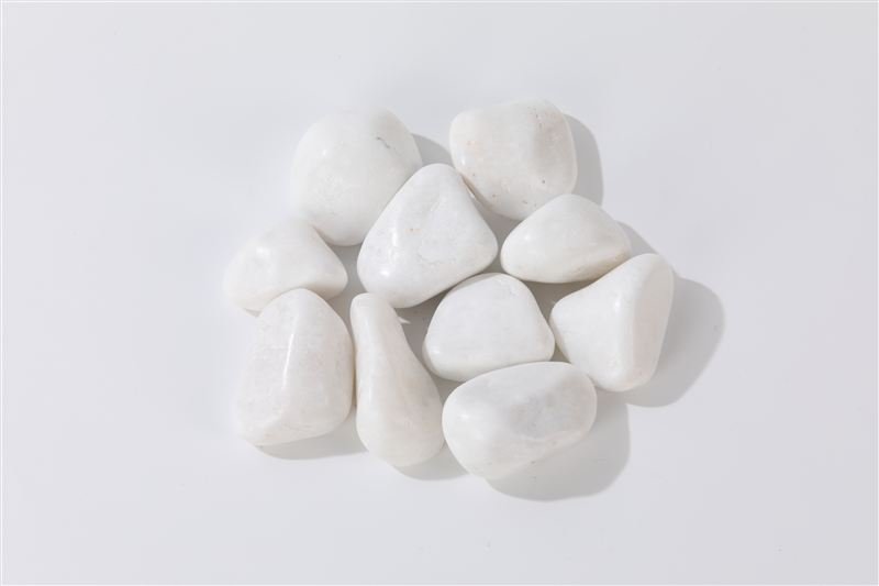 Snow white high polished pebbles in 30–50mm showing natural shape variation