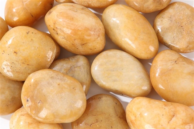 Yellow high polished pebbles shown in closer detail