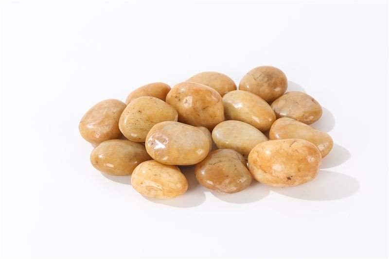 Close-up of yellow high polished pebbles in 20–30mm