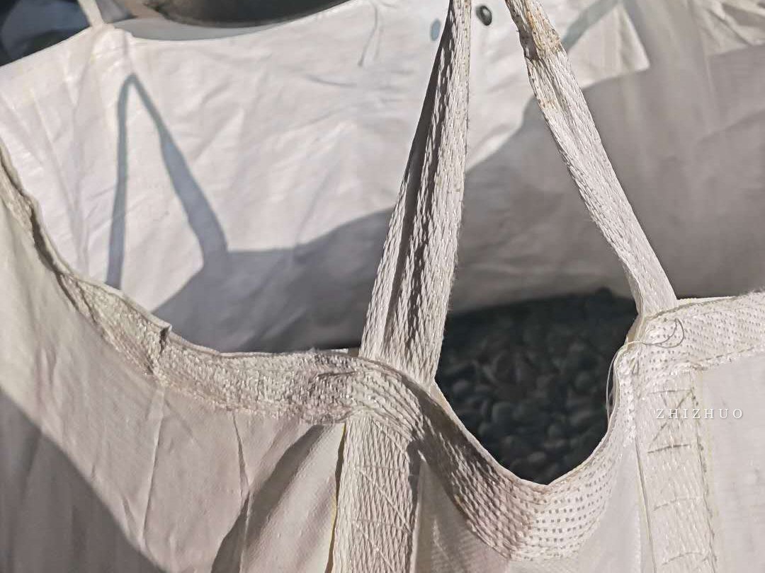 Pebbles inside an open export tonne bag