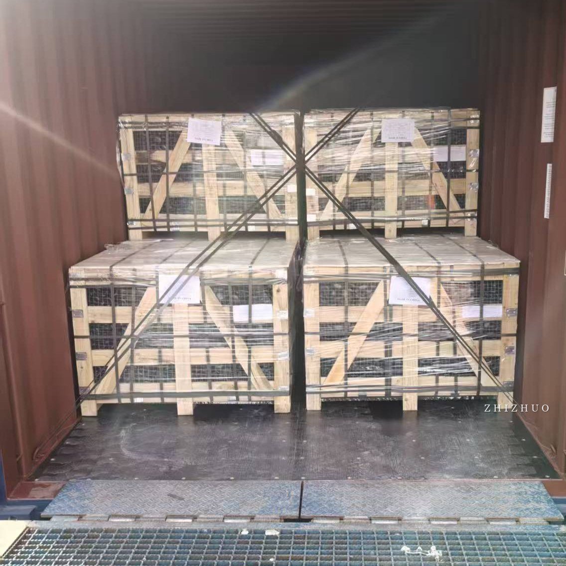 Decorative stone crates secured inside export shipping container
